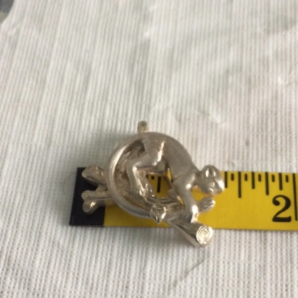 Woman’s Vintage Brooch of a Monkey on a branch made of Sliver